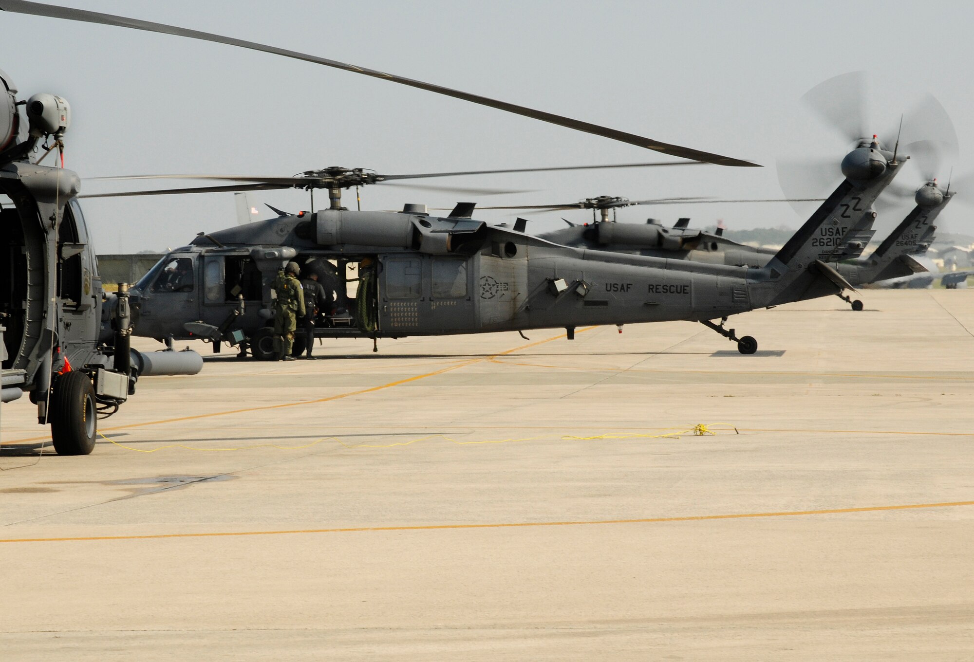 Crew members board an HH-60 Pave Hawk before an air refueling mission off the Coast of Okinawa, Japan as part of exercise Cope Angel 09-1. Cope Angel is a joint rescue exercise between members of the U.S. Air Force and the Japanese Air Self Defense Force. (U.S. Air Force photo/Airman 1st Class Chad Warren)