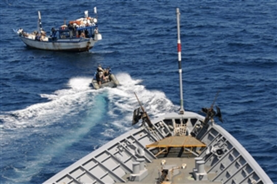 U.S. sailors assigned to the guided-missile cruiser USS Vella Gulf use a rigid-hulled inflatable boat to approach a dhow needing assistance in the Gulf of Oman, Feb. 7, 2009. The sailors boarded the dhow to assist local fishermen in an attempt to repair their engine. Vella Gulf is the flagship for Combined Task Force 151, a multinational task force conducting counterpiracy operations to detect and deter piracy in and around the Gulf of Aden, Arabian Gulf, Indian Ocean and Red Sea. 
