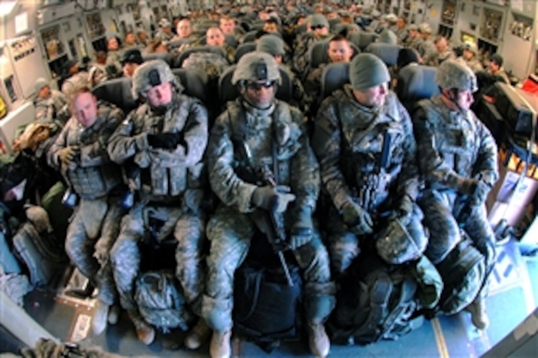 U.S. Army soldiers sit board a C-17 Globemaster aircraft on Manas Air Force Base, Kyrgyzstan, Feb. 6, 2009. The soldiers, assigned to Company B, 1st Battalion, 4th Infantry Regiment, are flying out to support Operation Enduring Freedom.