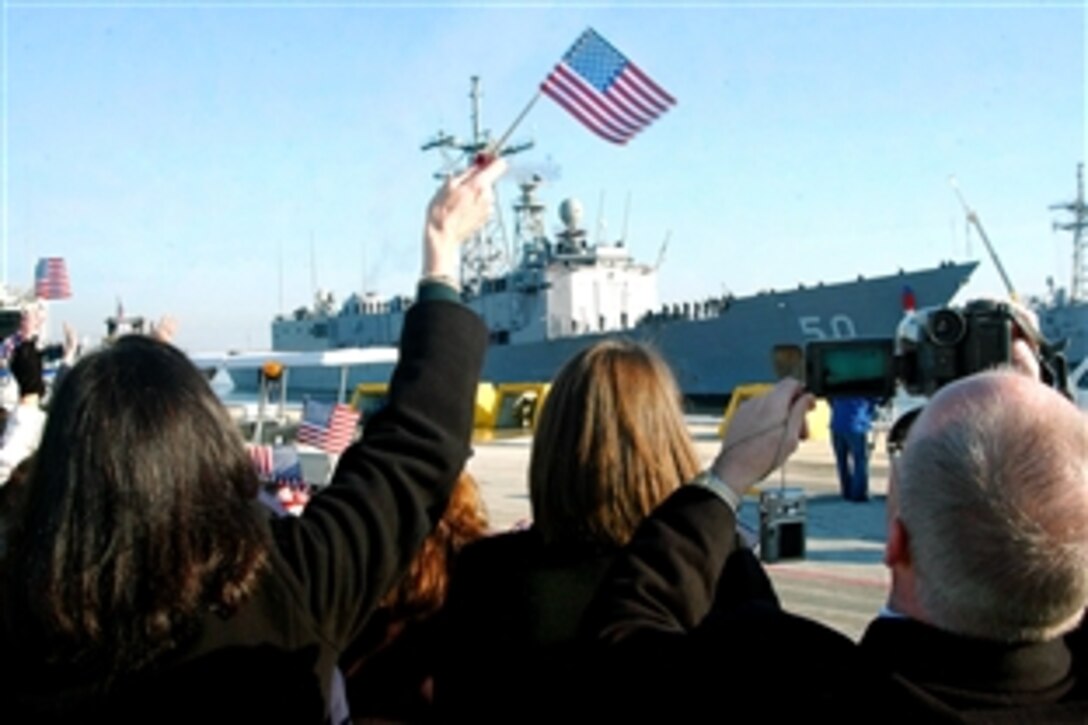 Friends and family await the return of the guided-missile frigate USS Taylor as it arrives home from a successful six-month deployment, Mayport, Fla., Feb. 6, 2009. While deployed, the USS Taylor participated in Operation Active Endeavor, a three-week operation which assured the safety and security of the Mediterranean.
