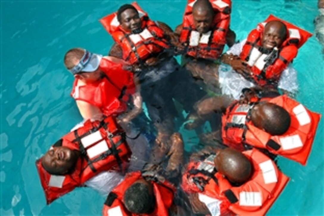 John LaFargue, a fisheries logistical trainer with National Oceanic and Atmospheric Administration, conducts water-survival training with Senegalese marine biologists in Dakar, Senegal, Feb. 5, 2009. Africa Partnership Station, supported largely by the U.S. Navy, and the government agency are working together to advance the art and science of maritime operations.