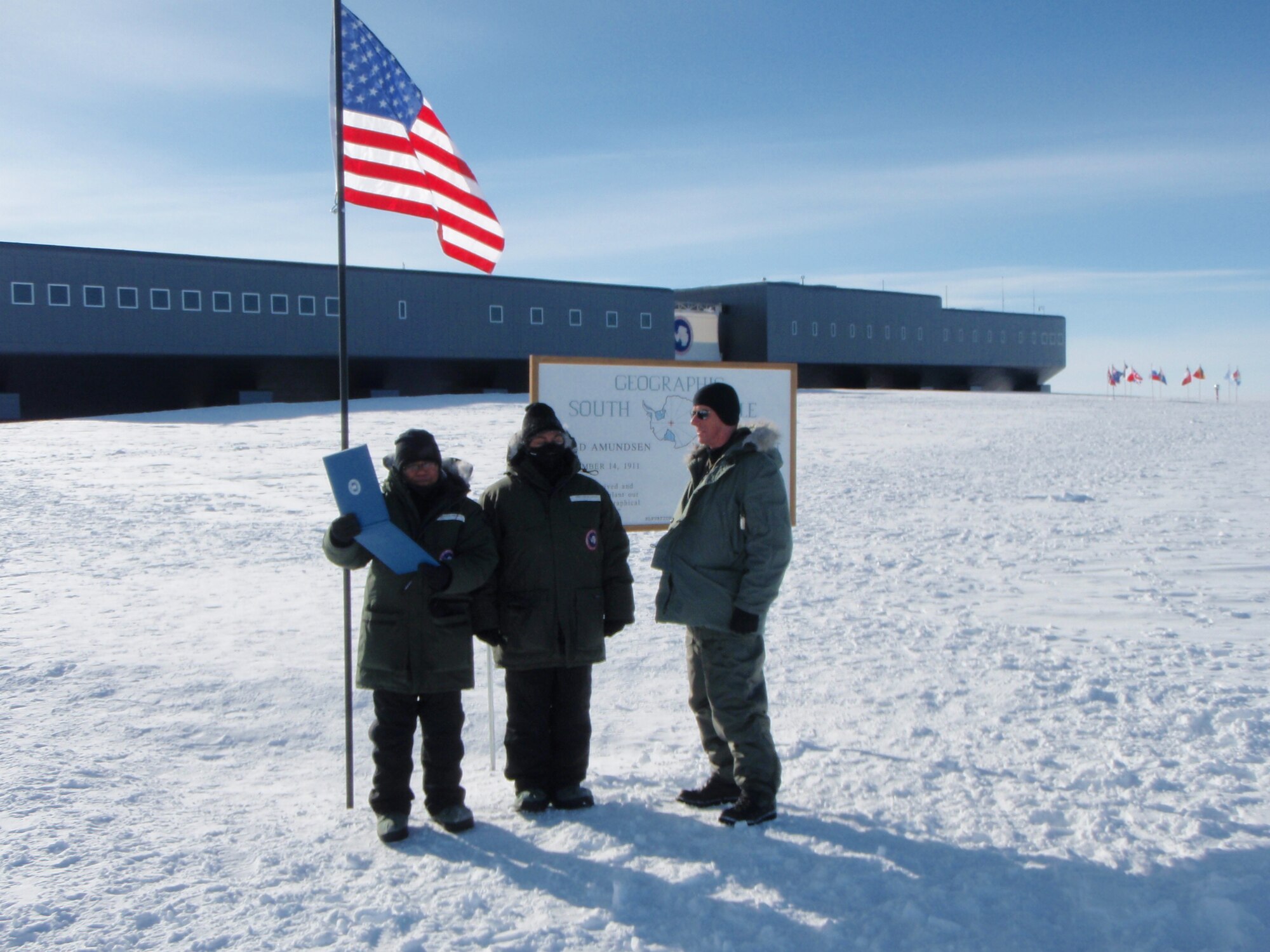 Tech. Sgt. Leslie Green is promoted at the geographic South Pole. Kadena's 18th Aeromedical Evacuation Squadron deployed to Antarctica in support of Operation Deep Freeze.  (U.S. Air Force courtesy photo)