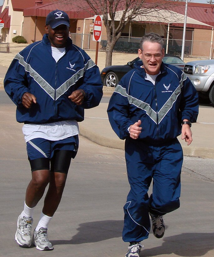 Col. Otha Solomon, left, 71st Medical Group commander, and Chief Master Sgt. Jeffrey Griner, 71st MG superintendent, head for the finish line at the Feb. 6 African-American History month 5K Fun Run. More than 40 Team Vance members participated in the run. (U.S. Air Force photo by Jenny Hughes)