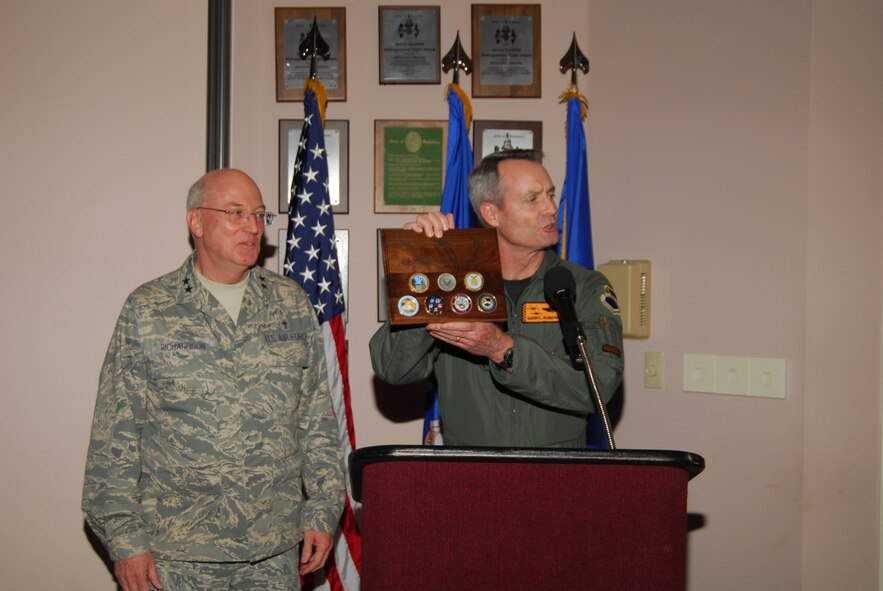 Brig. Gen. Darryl Roberson, 325th Fighter Wing commander, presents Chaplain (Maj. Gen.) Cecil R. Richardson, Chief of Chaplains, Headquarters U.S. Air Force, Washington, D.C., a plaque containing coins from the 325th Fighter Wing during the National Prayer luncheon held at the Heritage Club today.  (U.S. Air Force photo by Lisa Norman)