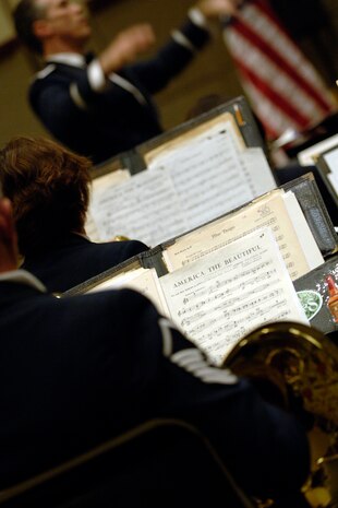 The band performs one of their final songs, America the Beautiful by Carmen Dragon, at the Charleston Coliseum Feb. 6.  The Heritage of America Band is comprised of 47 professional active-duty musicians who perform for more than 1 million people each year in venues from formal, informal and even Major League Baseball and NASCAR.  (U.S. Air Force photo/Senior Airman Timothy Taylor)
