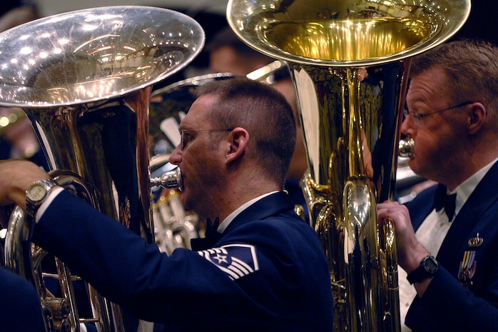 Airmen of the United States Air Force Heritage of America Band perform the song Belle of the Ball by Leroy Anderson at the Charleston Coliseum Feb. 6. The Heritage of America Band is comprised of 47 professional active-duty musicians who perform for more than 1 million people each year in venues from formal, informal and even Major League Baseball and NASCAR.  (U.S. Air Force photo/Senior Airman Timothy Taylor)
