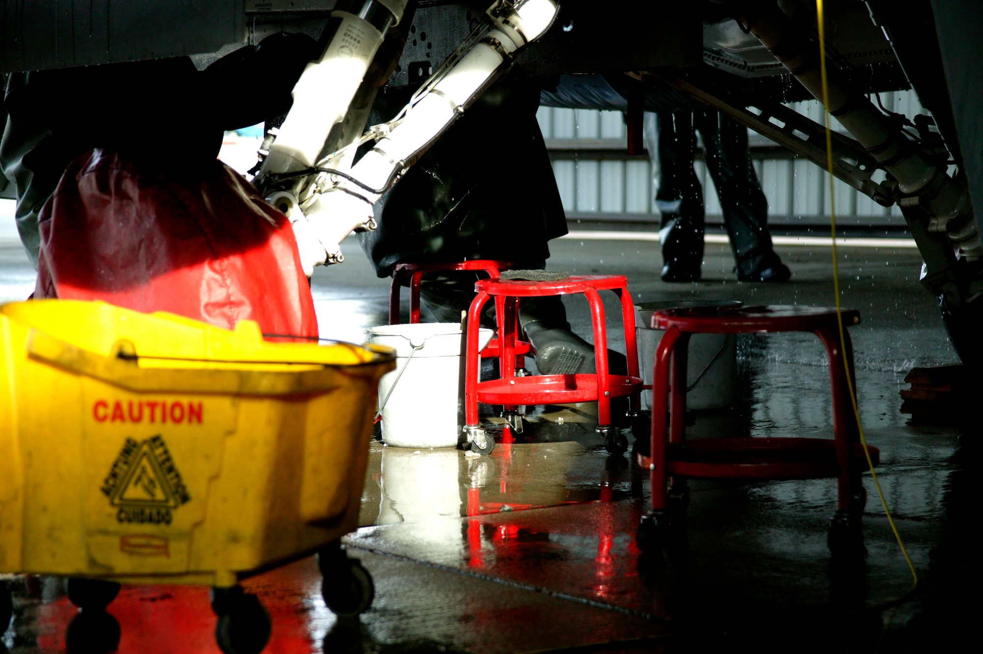 SHAW AIR FORCE BASE, S.C.-- Six maintenance group CGOs and four Airmen spent about three hours washing an F-16 in the Wash Rack Feb. 10. The CGOs don't normally wash jets, they took the day to get an insider's perspective on a task that maintenance Airmen would normally do. F-16s are washed every 60 days to keep them mission-ready. (U.S. Air Force photo/SSgt Holly Brown)