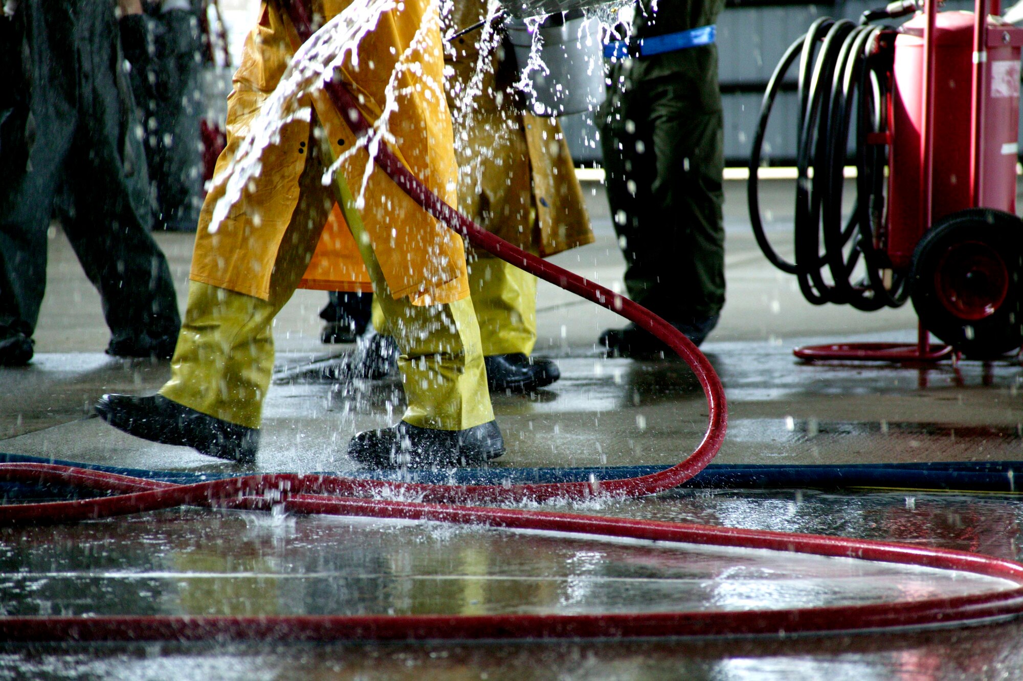 SHAW AIR FORCE BASE, S.C.-- Six maintenance group CGOs and four Airmen spent about three hours washing an F-16 in the Wash Rack Feb. 10. The CGOs don't normally wash jets, they took the day to get an insider's perspective on a task that maintenance Airmen would normally do. F-16s are washed every 60 days to keep them mission-ready. (U.S. Air Force photo/SSgt Holly Brown)