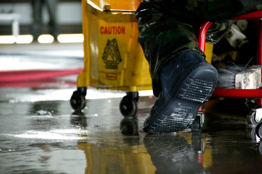 SHAW AIR FORCE BASE, S.C.-- Six maintenance group CGOs and four Airmen spent about three hours washing an F-16 in the Wash Rack Feb. 10. The CGOs don't normally wash jets, they took the day to get an insider's perspective on a task that maintenance Airmen would normally do. F-16s are washed every 60 days to keep them mission-ready. (U.S. Air Force photo/SSgt Holly Brown)