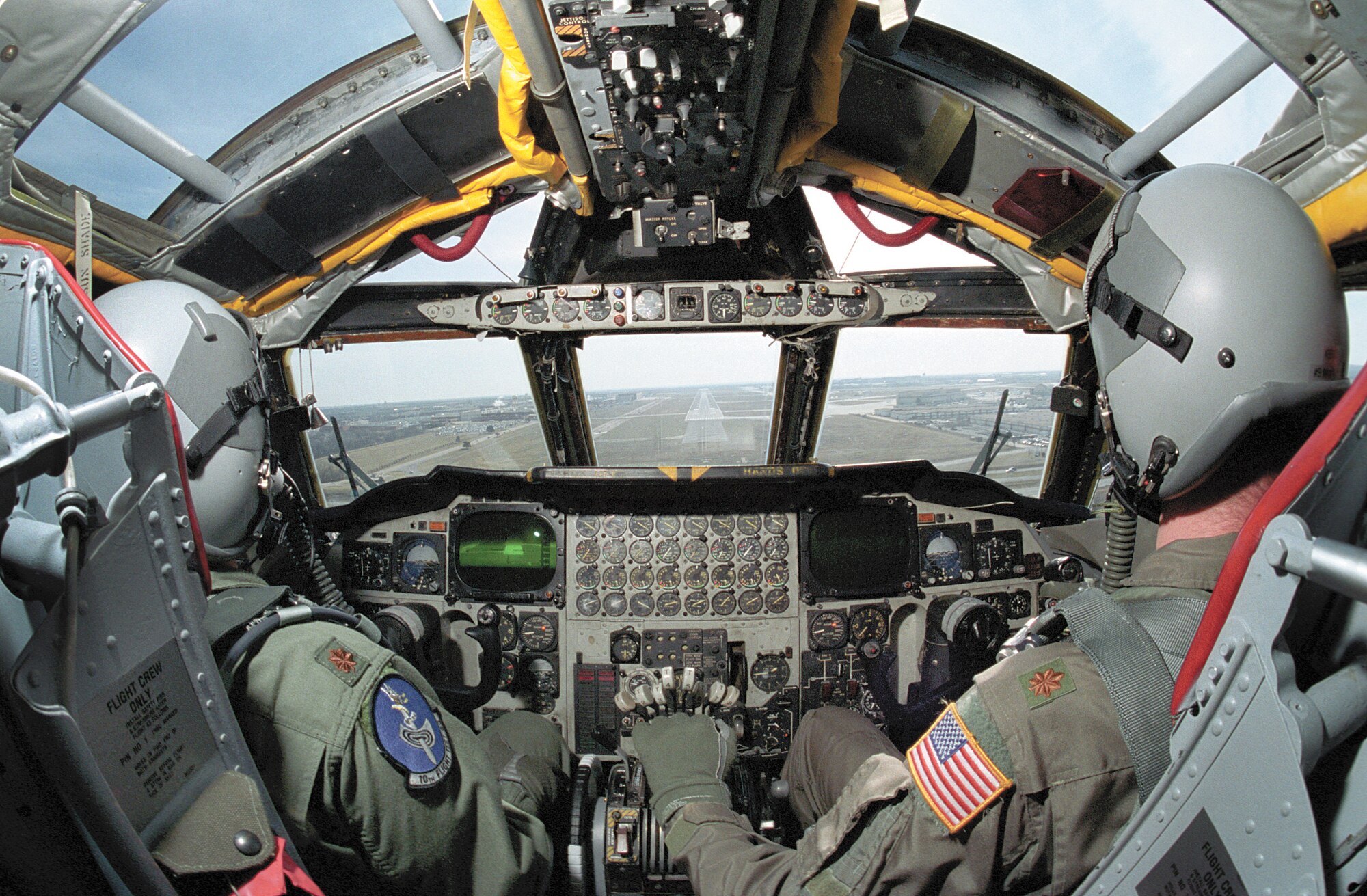10th Flight Test Squadron members, Maj. Tim Hines, left, and Maj. Cary Montgomery bring a B-52 back to Tinker.  The crew will then fly the aircraft back to its home station after any work is done. (Air Force photo/Margo Wright)