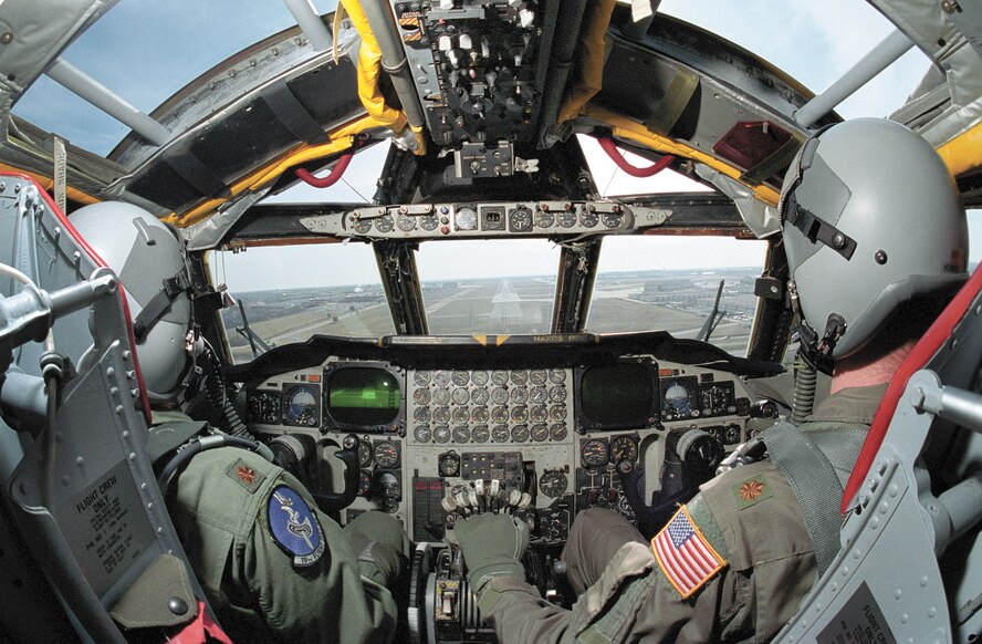 10th Flight Test Squadron members, Maj. Tim Hines, left, and Maj. Cary Montgomery bring a B-52 back to Tinker. The crew will then fly the aircraft back to its home station after any work is done. (Air Force photo by Margo Wright) 