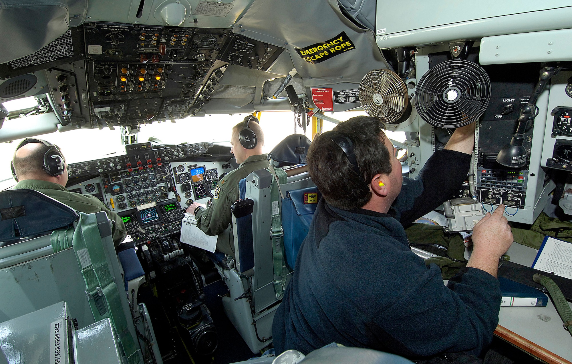 A KC-135 crew from the 10th FTS works closely with Air Logistics Center maintenance professionals during a pre-flight inspection on a jet fresh from the depot. Engine mechanic Matt Jennings, 564th Aircraft Maintenance Squadron, looks over an area while pilots Maj. Kelly Buck, left, and Maj. John Cary test every aspect of the jet’s functions. The meticulous pre-flight may take up to three hours before the aircraft is tested in the air to ensure its air-worthiness.(Air Force photo by Margo Wright)