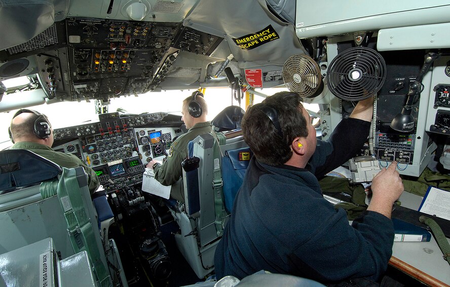 A KC-135 crew from the 10th FLTS works closely with Air Logistics Center maintenance professionals during a pre-flight inspection on a jet fresh from the depot. Engine mechanic Matt Jennings, 564th Aircraft Maintenance Squadron, looks over an area while pilots Maj. Kelly Buck, left, and Maj. John Cary test every aspect of the jet’s functions. The meticulous pre-flight may take up to three hours before the aircraft is tested in the air to ensure its air-worthiness.(Air Force photo by Margo Wright) 
