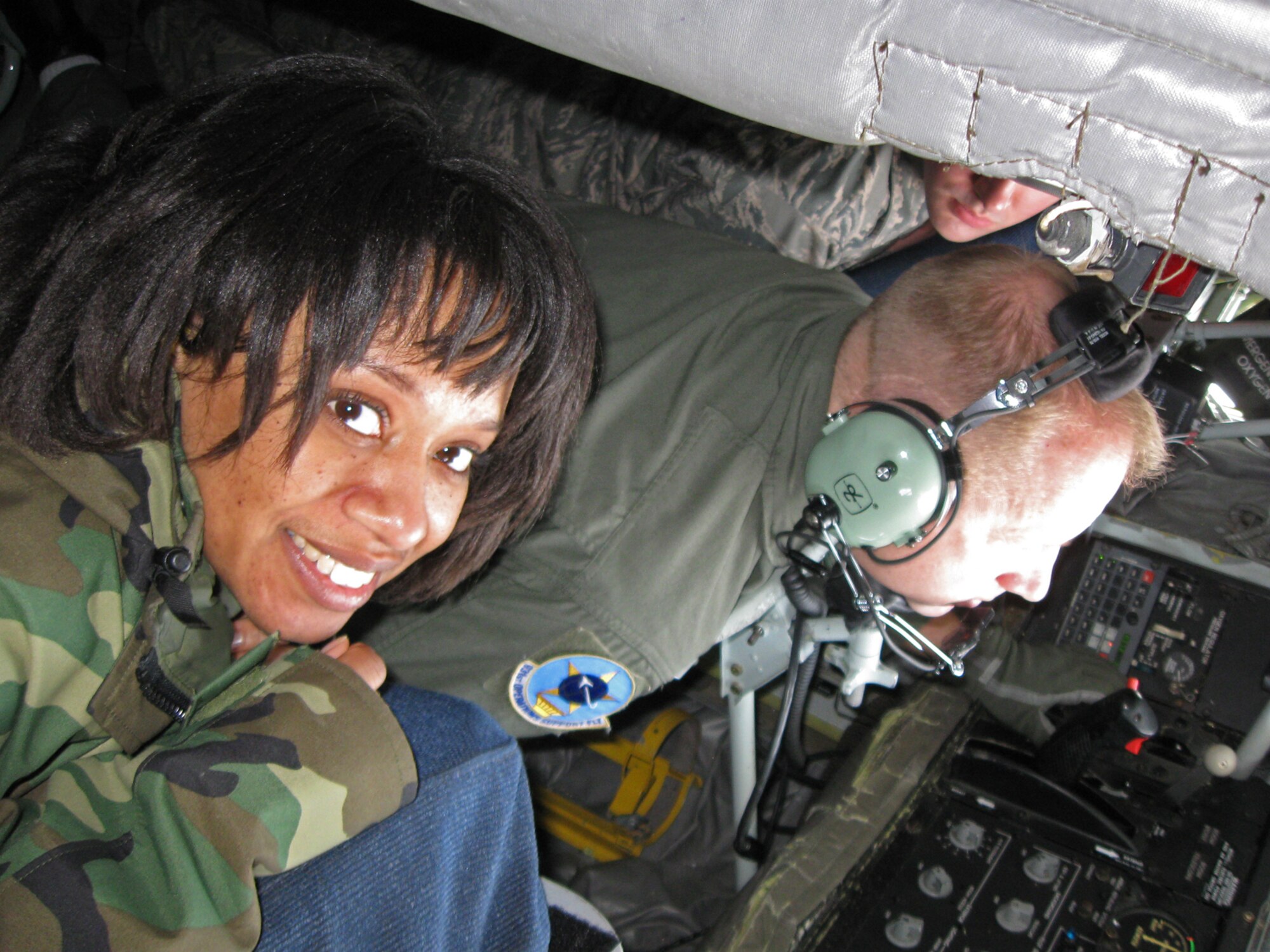 Staff Sgt. Tamara Wilson looks up from the boom pod of a KC-135 Stratotanker she flew in during the 931st Air Refueling Group's drill weekend in February. Watching the tanker refuel another KC-135 was part of an incentive flight designed to show Sergeant Wilson and other Reservists an up-close look at air refueling, the 931st's primary mission. Sergeant Wilson is a public health technician assigned to the 931st Aerospace Medicine Flight, an Air Force Reserve unit at McConnell Air Force Base, Kan. (U.S. Air Force photo/Staff Sgt. Jay Guldjord)