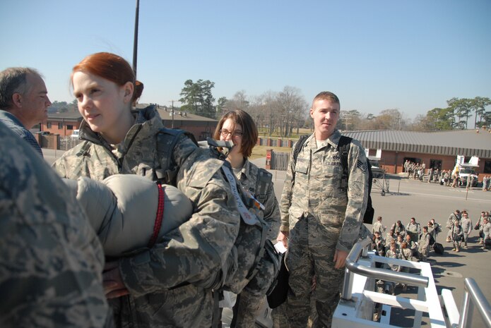 Airmen from various bases throughout the Air Force wait to board an aircraft bound for Southwest Asia in support of Operations Enduring and Iraqi Freedom on Charleston AFB Feb. 7. Charleston AFB is one of four aerial ports of embarkation to make it more convenient for Airmen to deploy to the area of responsibility. (U.S. Air Force photo/Staff Sgt. Jennifer Arredondo)