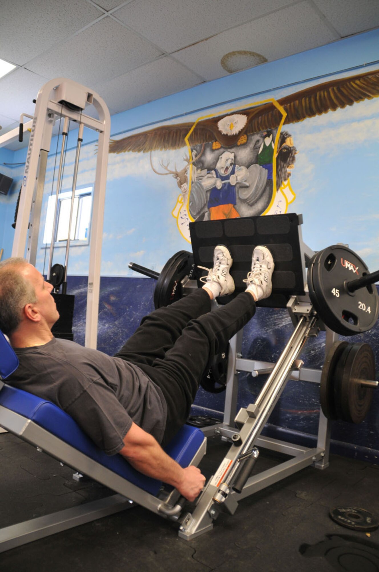 Senior Master Sgt. Chuck Muscato uses the leg press in the base gym. The leg press is just one of many new pieces of weight equipment at the gym now.