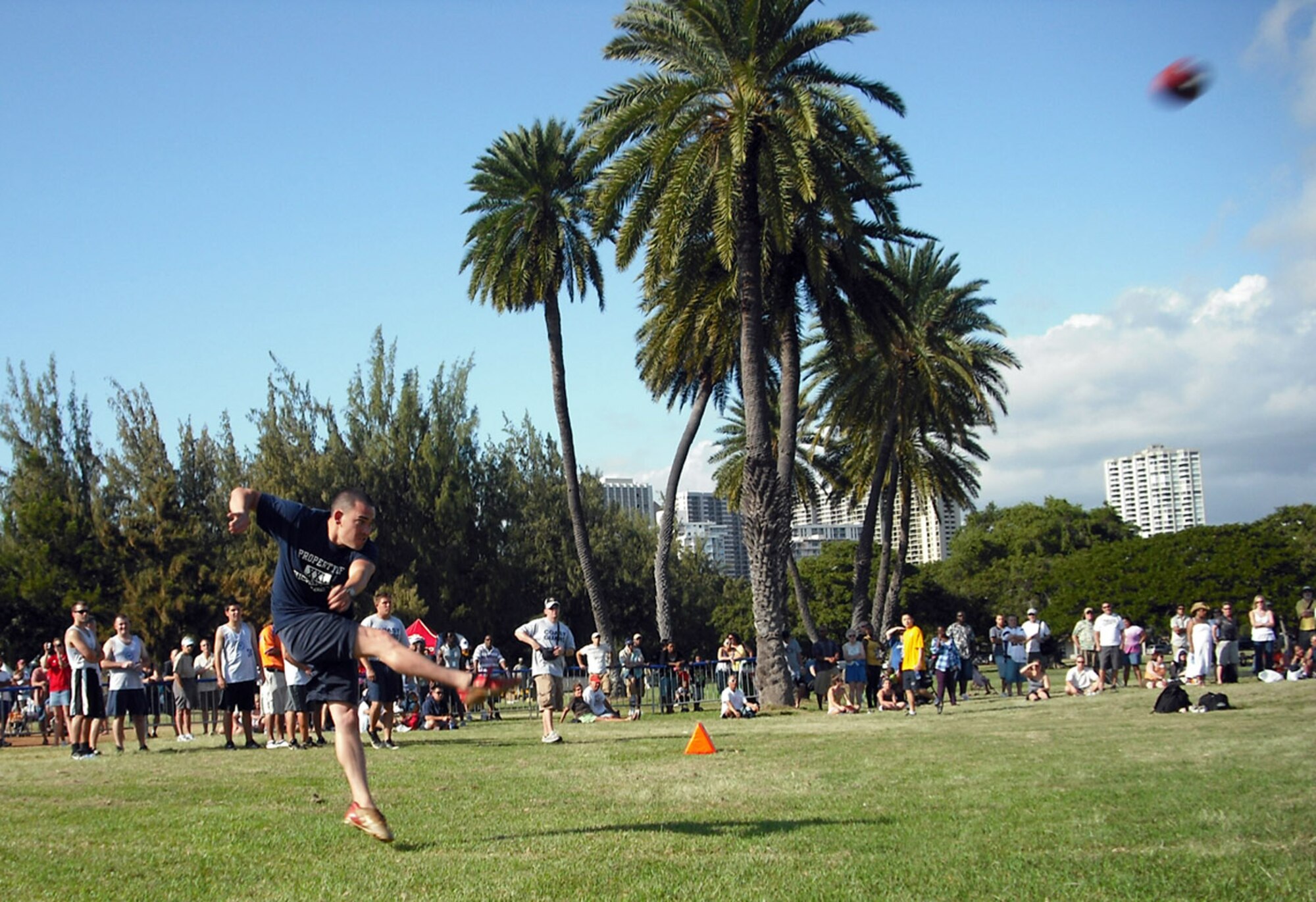 Senior airman Nathan Angel booms a 37-yard punt during the NFL Military Challenge Feb. 7 in Oahu's Kapiolani Park. For the fourth year in a row, the Air Force team defeated all-star teams from the Army, Navy, Marines and Coast Guard. (U.S. Air Force photo/Mark Munsey) 