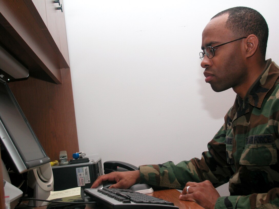 GRISSOM AIR RESERVE BASE, Ind., -- Tech. Sgt. Randall Calmese, a knowledge operations manager with the 434th Aircraft Maintenance Squadron, processes and verifies personnel information during a unit training assembly.  (U.S. Air Force photo/Staff Sgt. Chris Bolen)          