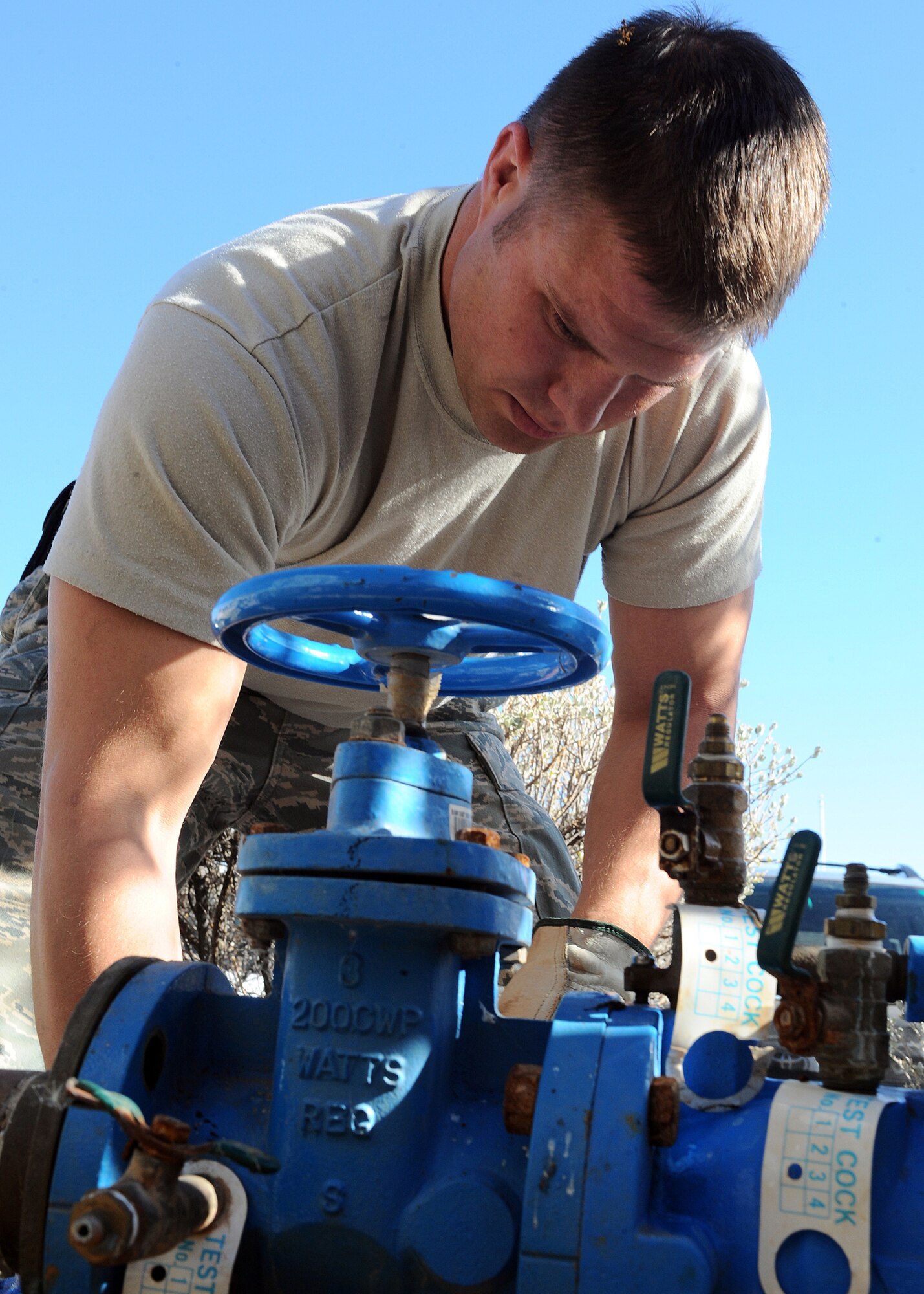 Staff Sgt. Destrey Robbins, 49th Civil Engineer Squadron, repairs a broken water main outside of building 224 at Holloman Air Force Base, N.M., Feb. 6. Sergeant Robbins was fixing a leak. (U.S Air Force photo/ Airman 1st Class DeAndre Curtiss)