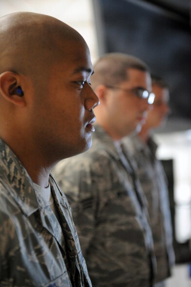 DYESS AIR FORCE BASE, Texas -- Just before the beginning of the 8th Air Force Giant Sword II weapons loading competition, the 7th Bomb Wing load team stands at parade rest while being read the rules for the competition here, Feb 9. The 7th Bomb Wing finished the load in 22 minutes. (U.S. Air Force photo by Senior Airman Domonique Simmons)