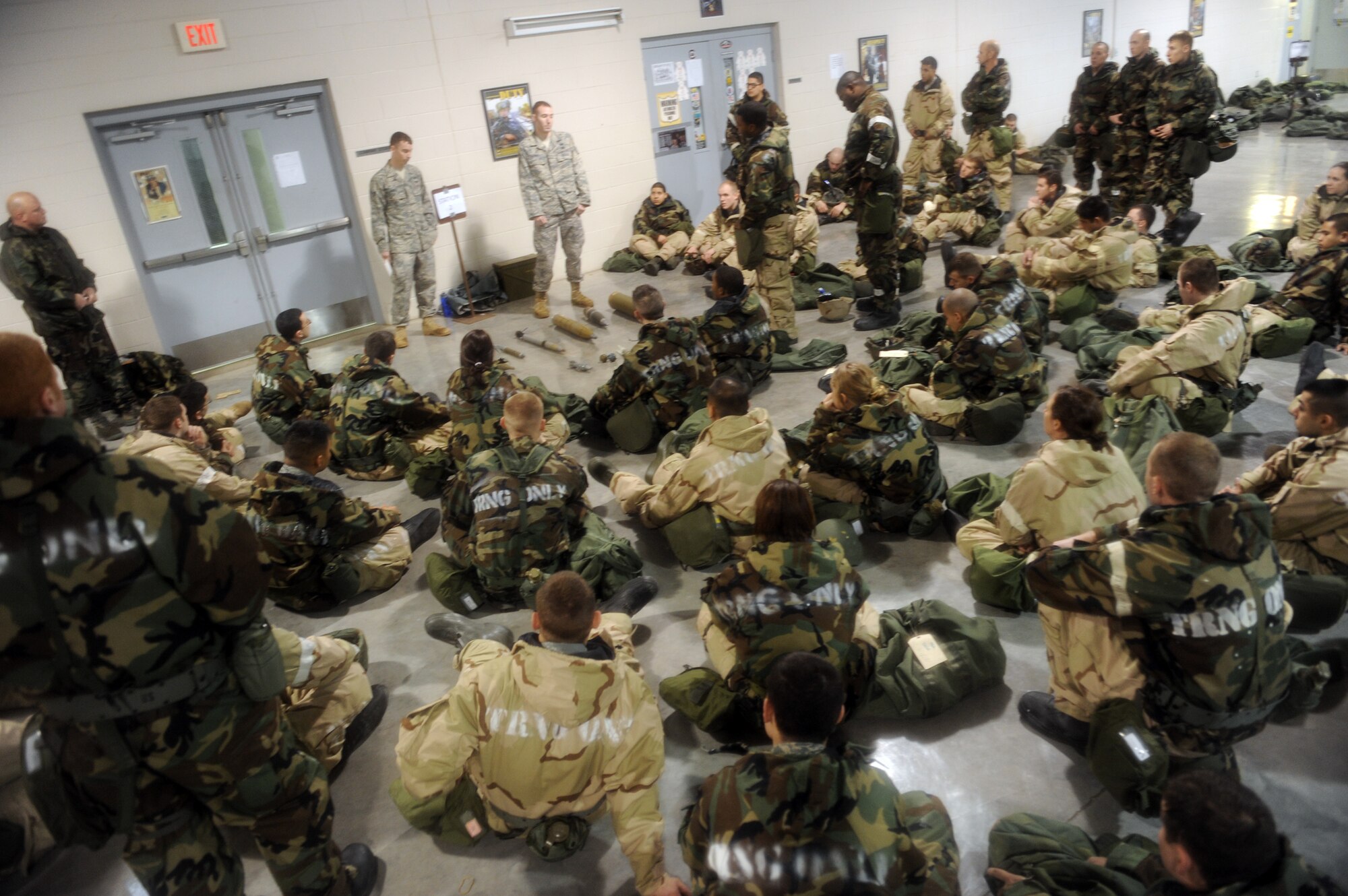 WHITEMAN AIR FORCE BASE, Mo. – Staff Sgt. Angelo Giannosa, 509th Civil Engineer Squadron, shows   Ability To Survive and Operate training participants different explosive ordnances Feb. 11. The training provided and evaluated how well personnel use their chemical protection ensemble, how to recognize unexploded munitions and cordon off the areas to prevent other personnel from detonating the devices. (U.S. Force photo/Senior Airman Stephen Linch)