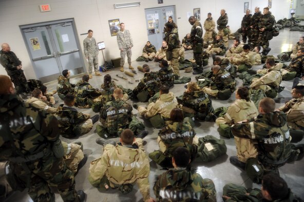 WHITEMAN AIR FORCE BASE, Mo. – Staff Sgt. Angelo Giannosa, 509th Civil Engineer Squadron, shows   Ability To Survive and Operate training participants different explosive ordnances Feb. 11. The training provided and evaluated how well personnel use their chemical protection ensemble, how to recognize unexploded munitions and cordon off the areas to prevent other personnel from detonating the devices. (U.S. Force photo/Senior Airman Stephen Linch)