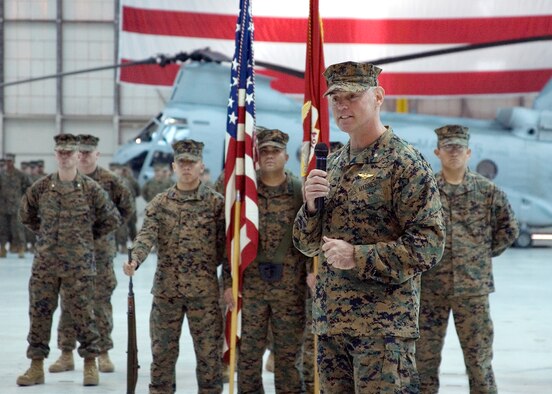 Marine Lt. Col. Marcus Malais, Medium Helicopter Squadron 764 commanding officer, addresses the audience during the HMM 764 change of command ceremony at hangar 1210 here Feb. 7. The HMM 764 is responsible for managing CH-46E Sea Knight transport helicopters. (Air Force photo by Jet Fabara)