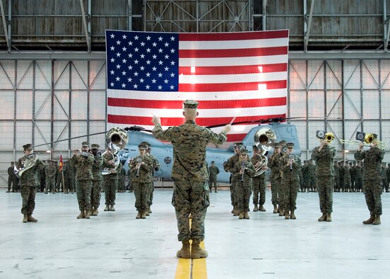 A Marine marching band plays during the Medium Helicopter Squadron 764 change of command ceremony at hangar 1210 here Feb. 7. Marine Lt. Col. Marcus Malais received the HMM 764 commandship from Lt. Col. David Cleary. The HMM 764 is responsible for managing CH-46E Sea Knight transport helicopters.  (Air Force photo by Jet Fabara)