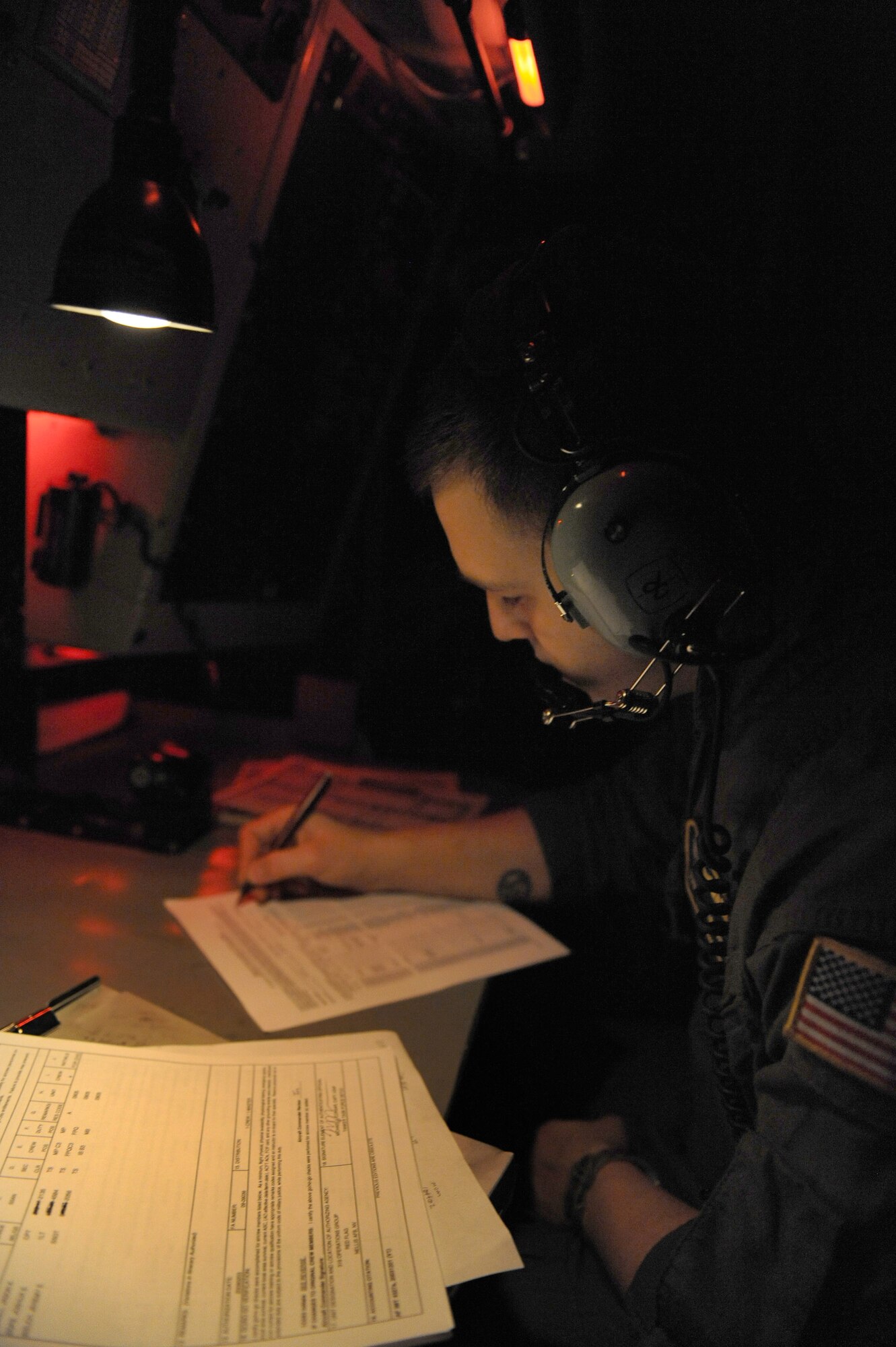 Staff Sgt. Jeremy Welch documents a pre-flight inspection Feb. 3 in the cockpit of a KC-135 Stratotanker during a Red Flag exercise at Nellis Air Force Base, Nev.  Red Flag is a multi-national exercise providing a realistic environment to practice combat scenarios.  The experience gained during the exercise is vital to the survival of air crews in combat.  Sergeant Welch is a boom operator with the 905th Air Refueling Squadron at Grand Forks AFB, N.D.  (U.S. Air Force photo/Senior Airman Nadine Y. Barclay)