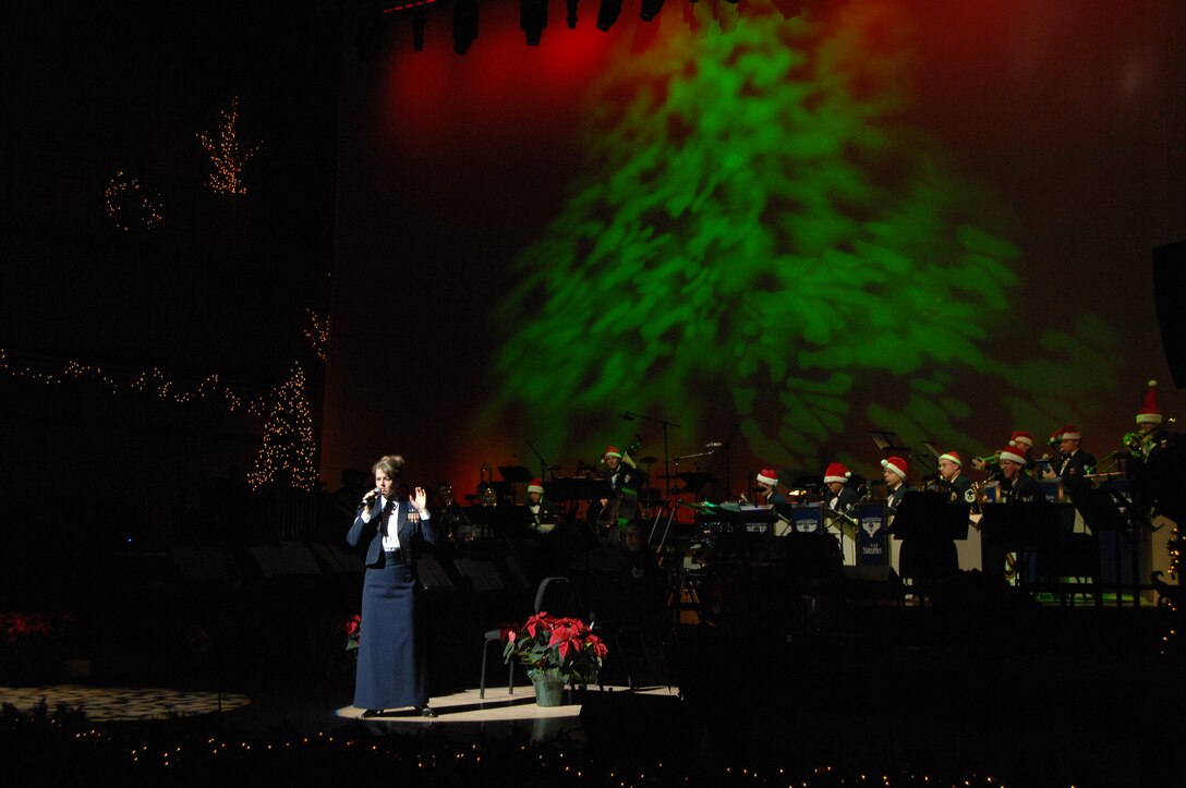 Staff Sgt. Krista Joyce, vocalist, and The Noteables jazz ensemble perform a dazzling rendition of 'Zat You Santa Claus' during the USAF Heartland of America Band's Holiday Show "The Promise of the Season."