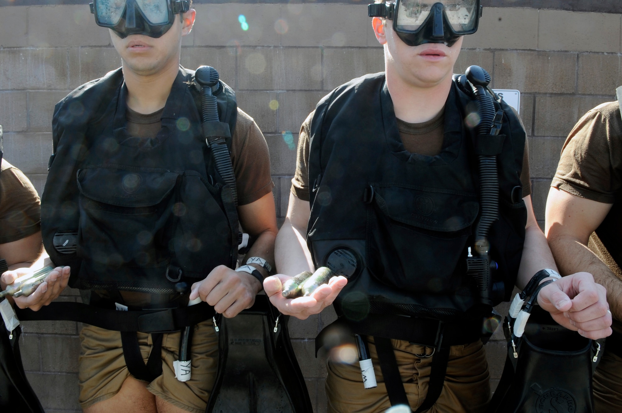 Special Operations Airmen in training wait to be inspected  Feb. 10 during their pre-scuba formal training at Hurlburt Field, Fl. Instructors make sure their gear is placed in the proper place for safety precautions. Airmen are assigned to the Special Tactics Training Squadron. (U.S. Air Force photo/Staff Sgt. Desiree N. Palacios)