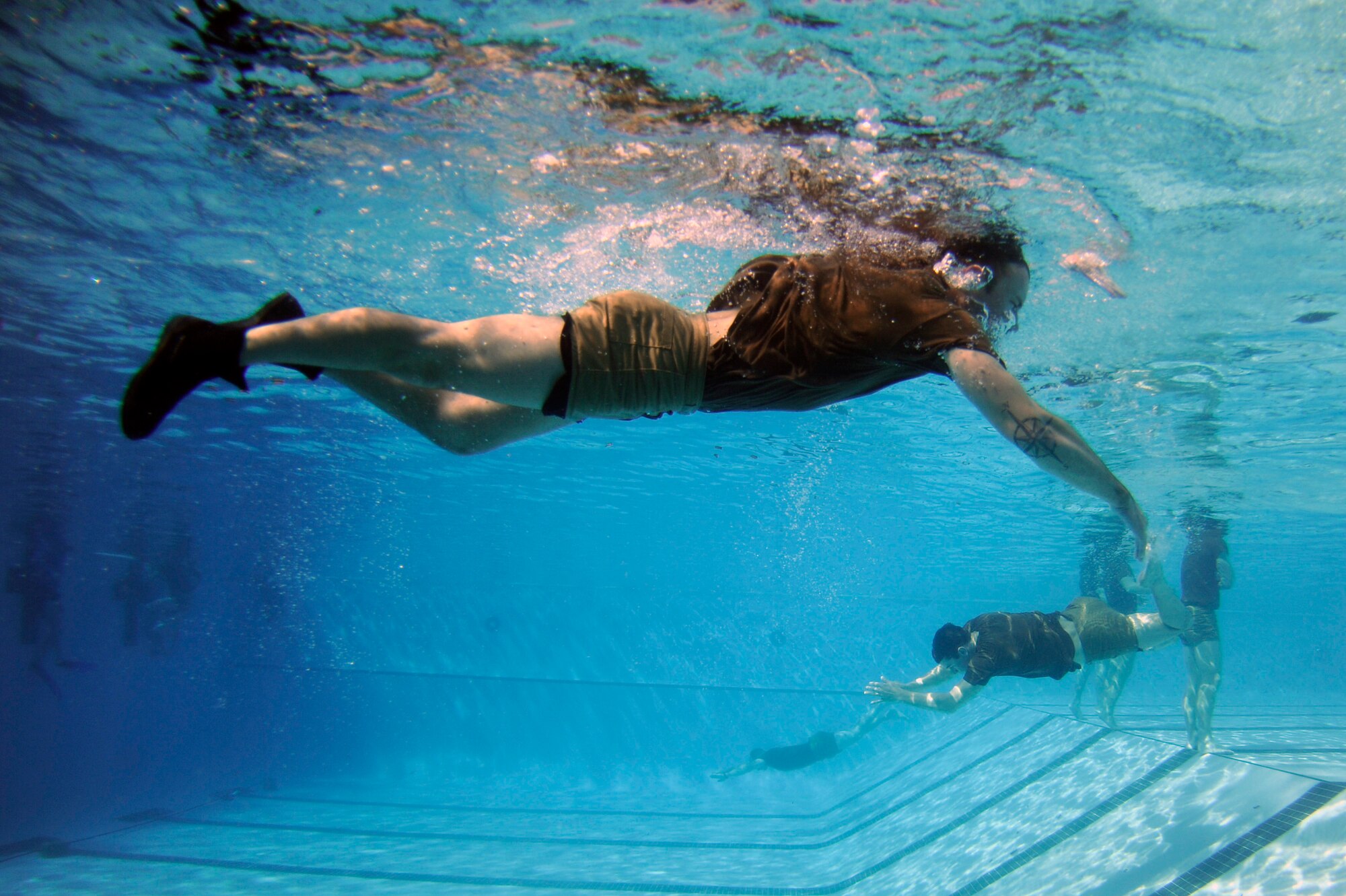 Special operations Airmen train in a swimming pool Feb. 10 during their pre-scuba formal training at Hurlburt Field, Fla. The Airmen are assigned to the Special Tactics Training Squadron. (U.S. Air Force photo/Staff Sgt. Desiree N. Palacios)