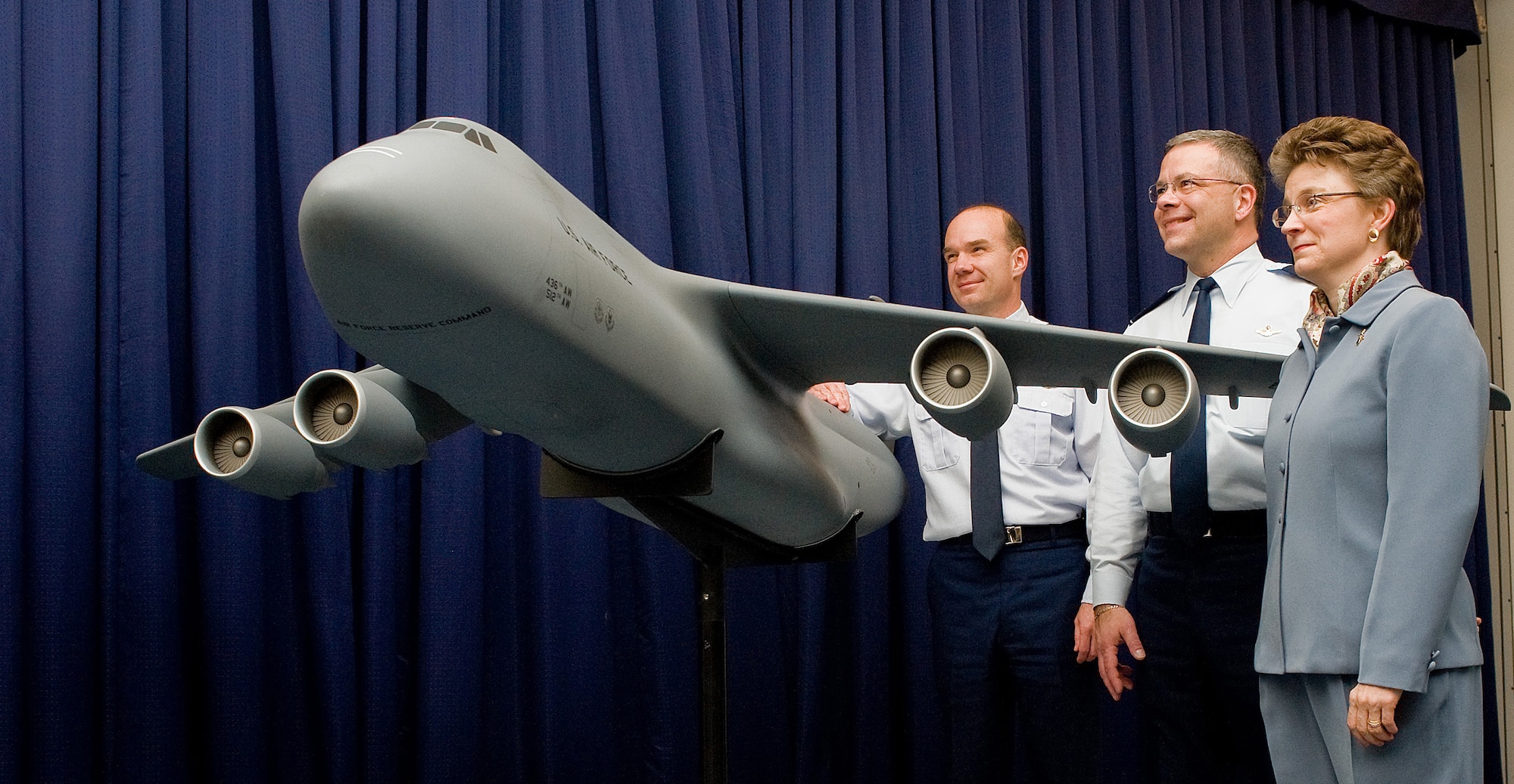 (Left to right) Col. Manson Morris, 436th Airlift Wing commander, Col. Randal Bright, 512th Airlift Wing commander, and Lorraine Martin, Lockheed Martin vice president, stand with a small model of the C-5M Super Galaxy Feb. 9 at The Landings Club. Ms. Martin presented the model to Team Dover following the delivery ceremony. (U.S. Air Force photo/ Tom Randle)