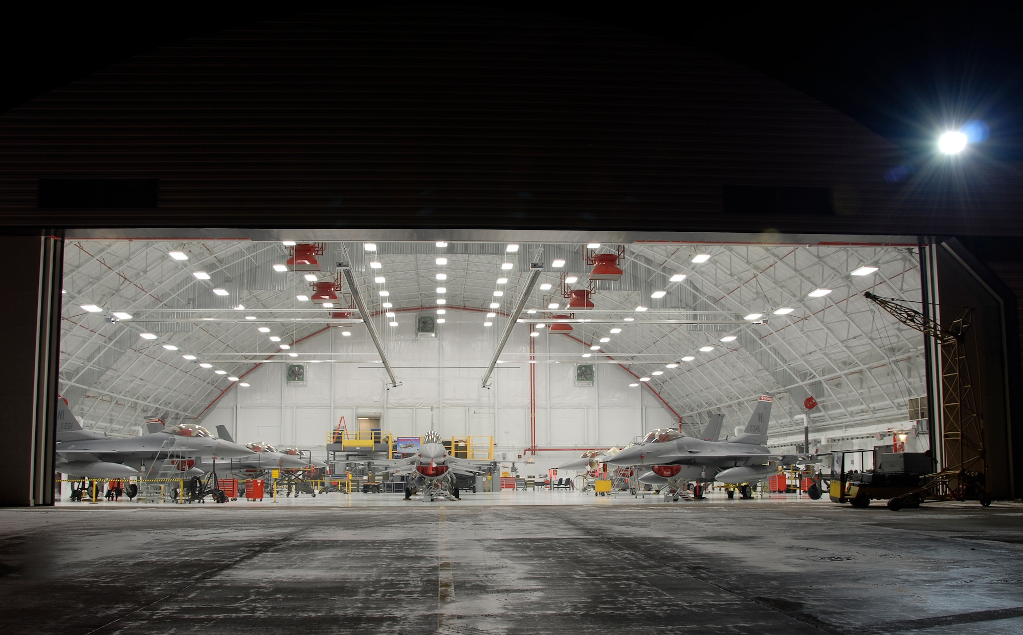 F-16C Fighting Falcons from the 115th Fighter Wing, Madison, Wis., are housed inside a newly remodeled aircraft hangar Jan. 23, 2008.  This $2 million facility upgrade project was completed Dec. 29, 2008 and included the installation of an upgraded fire suppression system, ceiling system, floor and new operational hangar doors.  (U.S. Air Force Photo by: Master Sgt. Dan Richardson) (Released)