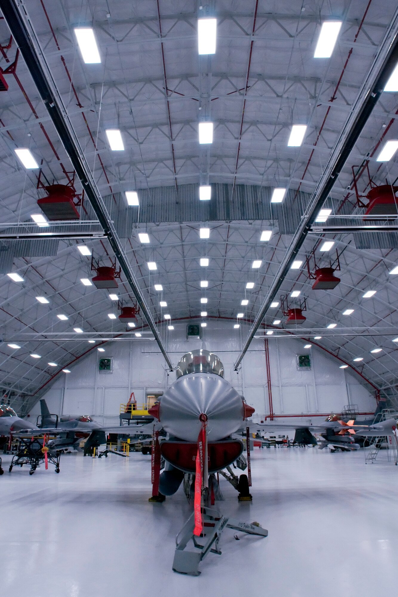 F-16C Fighting Falcons from the 115th Fighter Wing, Madison, Wis., are housed inside a newly remodeled aircraft hangar Jan. 23, 2008.  This $2 million facility upgrade project was completed Dec. 29, 2008 and included the installation of an upgraded fire suppression system, ceiling system, floor and new operational hangar doors.  (U.S. Air Force Photo by: Master Sgt. Paul Gorman) (Released)