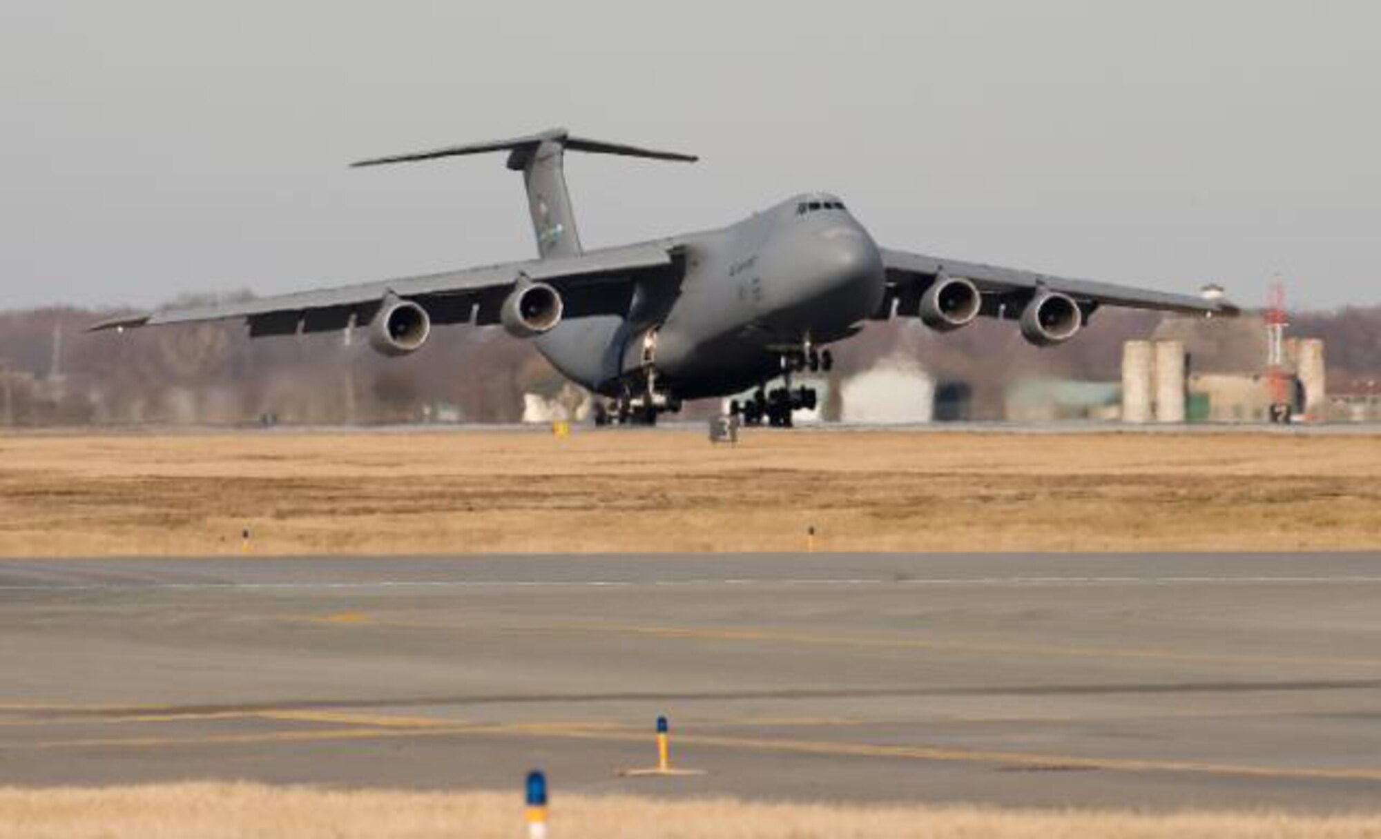 Team Dover's first C-5M Super Galaxy, the Spirit of Global Reach, lands at Dover Feb. 9.  Gen. Arthur Lichte, Air Mobility Command commander, was the delivery official.  (U.S. Air Force photo/Jason Minto)