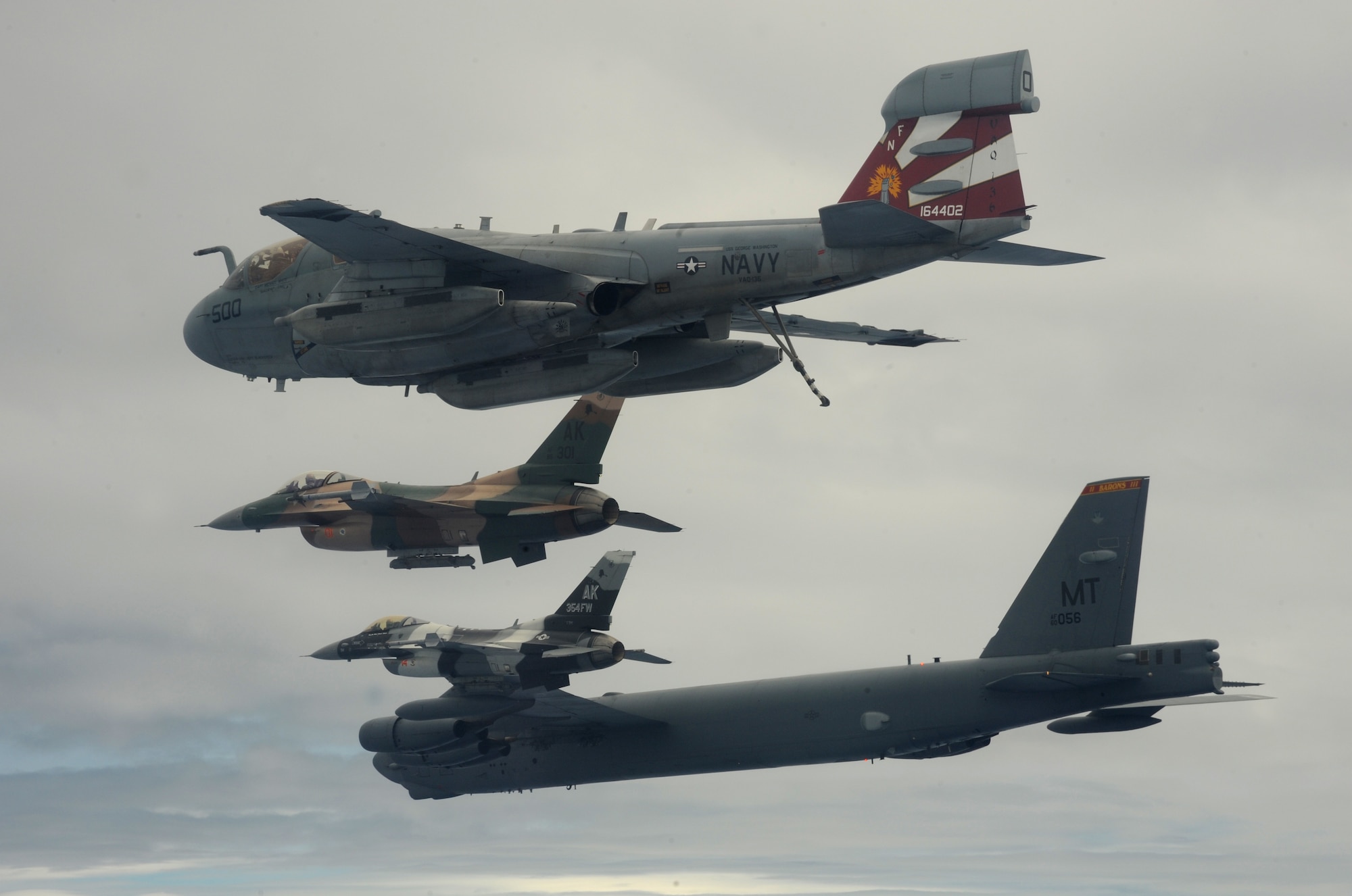 A B-52 Stratofortress currently deployed to Andersen AFB, Guam from the 23rdExpeditionary Bomb Squadron, leads a formation Feb. 10 of USAF F-16 Fighting Falcons from the 18th Aggressor Squadron, Eielson Air Force Base, Alaska, and a Navy EA-6B Prowler from VAQ-136 Carrier Air Wing Five, Atsugi, Japan over Guam during Cope North 09-1 at Andersen Air Force Base, Guam from Feb. 2-13. The Cope North exercise is one of the longest-running series of exercises in the Pacific theater.  Since the first Cope North exercise in 1978, thousands of American and Japanese personnel have honed skills that are vital to maintaining a high level of readiness. This will be the tenth time the United States and Japan have held a Cope North exercise on Guam, and it will be the fourth time that the JASDF will use live ordnance.(U.S. Air Force photo/ Master Sgt. Kevin J. Gruenwald) released      