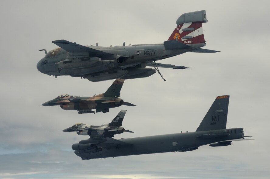 A B-52 Stratofortress currently deployed to Andersen AFB, Guam from the 23rdExpeditionary Bomb Squadron, leads a formation Feb. 10 of USAF F-16 Fighting Falcons from the 18th Aggressor Squadron, Eielson Air Force Base, Alaska, and a Navy EA-6B Prowler from VAQ-136 Carrier Air Wing Five, Atsugi, Japan over Guam during Cope North 09-1 at Andersen Air Force Base, Guam from Feb. 2-13. The Cope North exercise is one of the longest-running series of exercises in the Pacific theater.  Since the first Cope North exercise in 1978, thousands of American and Japanese personnel have honed skills that are vital to maintaining a high level of readiness. This will be the tenth time the United States and Japan have held a Cope North exercise on Guam, and it will be the fourth time that the JASDF will use live ordnance.(U.S. Air Force photo/ Master Sgt. Kevin J. Gruenwald) released      