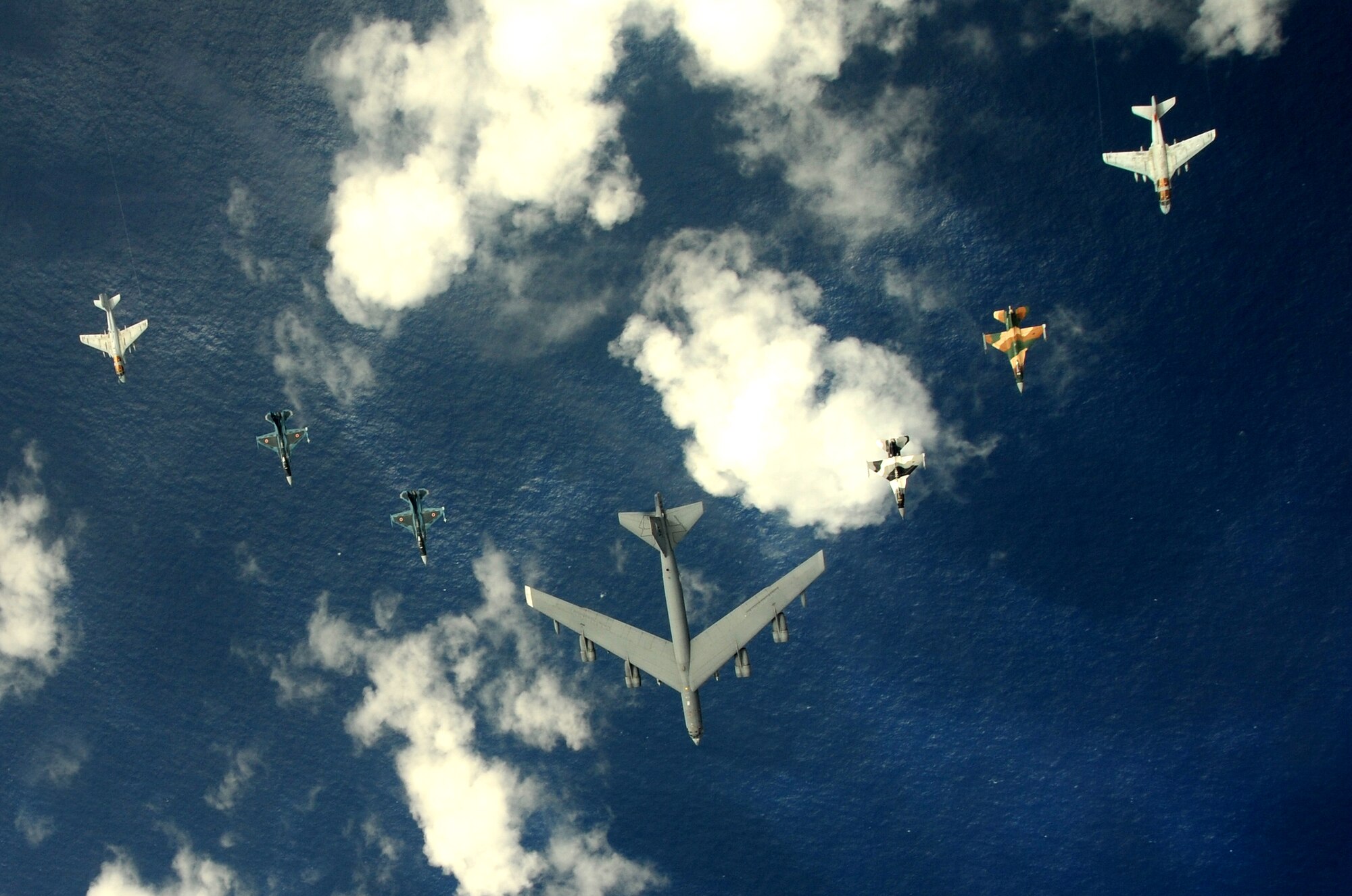 A B-52 Stratofortress currently deployed to Andersen AFB, Guam from the 23rdExpeditionary Bomb Squadron, leads a formation Feb. 10 of Japanese Air Self Defense Force F-2s from the 6th Squadron, Tsuiki Air Base, USAF  F-16 Fighting Falcons from the 18th Aggressor Squadron, Eielson Air Force Base, Alaska, and Navy EA-6B Prowlers from VAQ-136 Carrier Air Wing Five, Atsugi, Japan over Guam during Cope North 09-1 at Andersen Air Force Base from Feb. 2-13 The Cope North exercise is one of the longest-running series of exercises in the Pacific theater.  Since the first Cope North exercise in 1978, thousands of American and Japanese personnel have honed skills that are vital to maintaining a high level of readiness. This will be the tenth time the United States and Japan have held a Cope North exercise on Guam, and it will be the fourth time that the JASDF will use live ordnance.(U.S. Air Force photo/ Master Sgt. Kevin J. Gruenwald) released      