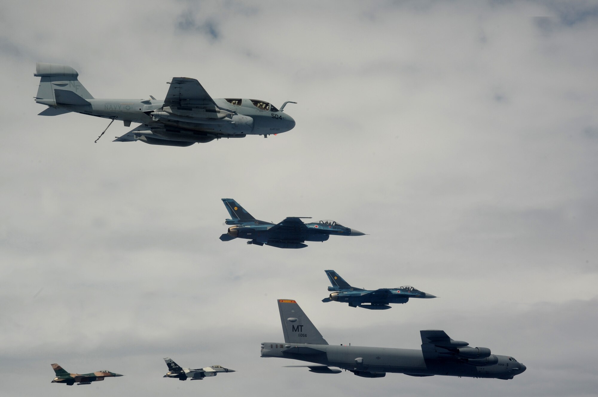 A B-52 Stratofortress currently deployed to Andersen AFB, Guam from the 23rdExpeditionary Bomb Squadron, leads a formation Feb. 10 of Japanese Air Self Defense Force F-2s from the 6th Squadron, Tsuiki Air Base, USAF  F-16 Fighting Falcons from the 18th Aggressor Squadron, Eielson Air Force Base, Alaska, and Navy EA-6B Prowlers from VAQ-136 Carrier Air Wing Five, Atsugi, Japan over Guam during Cope North 09-1 at Andersen Air Force Base from Feb. 2-13. The Cope North exercise is one of the longest-running series of exercises in the Pacific theater.  Since the first Cope North exercise in 1978, thousands of American and Japanese personnel have honed skills that are vital to maintaining a high level of readiness. This will be the tenth time the United States and Japan have held a Cope North exercise on Guam, and it will be the fourth time that the JASDF will use live ordnance.(U.S. Air Force photo/ Master Sgt. Kevin J. Gruenwald) released      