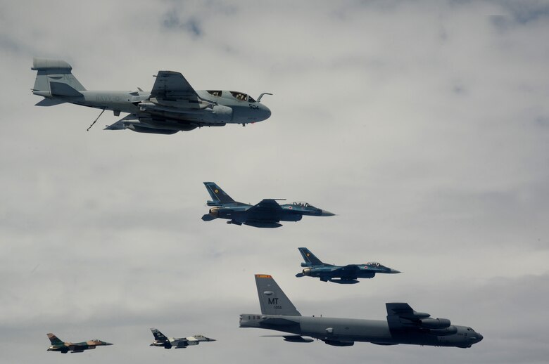 A B-52 Stratofortress currently deployed to Andersen AFB, Guam from the 23rd
Expeditionary Bomb Squadron, leads a formation Feb. 10 of Japanese Air Self Defense Force F-2s from the 6th Squadron, Tsuiki Air Base, USAF  F-16 Fighting Falcons from the 18th Aggressor Squadron, Eielson Air Force Base, Alaska, and Navy EA-6B Prowlers from VAQ-136 Carrier Air Wing Five, Atsugi, Japan over Guam during Cope North 09-1 at Andersen Air Force Base from Feb. 2-13. The Cope North exercise is one of the longest-running series of exercises in the Pacific theater.  Since the first Cope North exercise in 1978, thousands of American and Japanese personnel have honed skills that are vital to maintaining a high level of readiness. This will be the tenth time the United States and Japan have held a Cope North exercise on Guam, and it will be the fourth time that the JASDF will use live ordnance.

(U.S. Air Force photo/ Master Sgt. Kevin J. Gruenwald) released






















  












 











































  












 

























