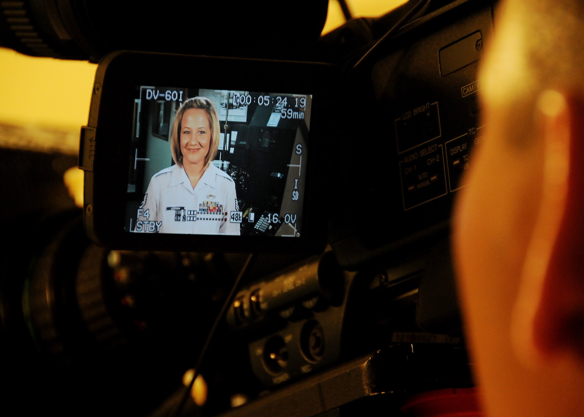 ANDERSEN AIR FORCE BASE, Guam – Staff Sgt. Jamie Lessard, 36th Wing Public Affairs photographer, co-hosts Joint Military News Network's first episode at Andersen's history museum Feb. 11. The network debuts Feb. 12 and will provide its viewers with up-to-date news and information that positively impacts Airmen and Sailor's lives on Guam. (U.S. Air Force photo by Senior Airman Nichelle Griffiths)