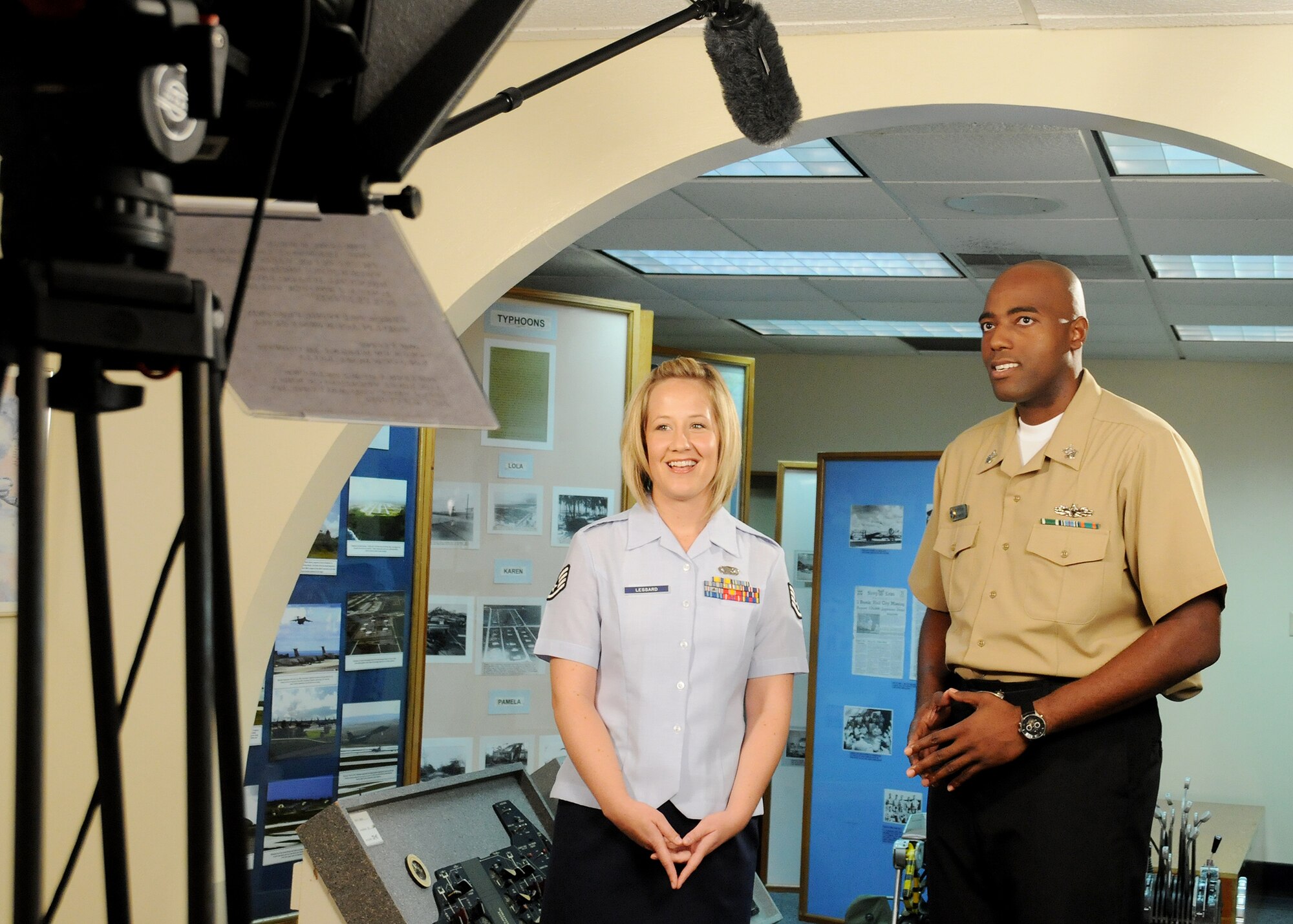 ANDERSEN AIR FORCE BASE, Guam - Staff Sgt. Jamie Lessard, 36th Wing Public Affairs photographer, co-hosts the first edition of Guam Military News Network's alongside Mass Communications Specialist 1st Class Jeffery Williams, Naval Base Guam Public Affairs Office, at Andersen's history museum Feb. 11. The show is scheduled to air the evening of Feb. 12. (U.S. Air Force photo by Senior Airman Nichelle Griffiths)