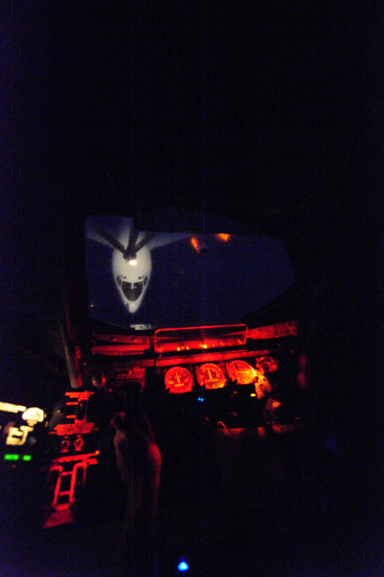 Airman 1st Class Tyler Williams refuels an E-8C Joint STARS over Iraq Feb. 10, 2009, in support of Operation Iraqi Freedom. Airman Williams is from Meridian, Miss. (U.S. Air Force photo by Staff Sgt. James L. Harper Jr.) Released