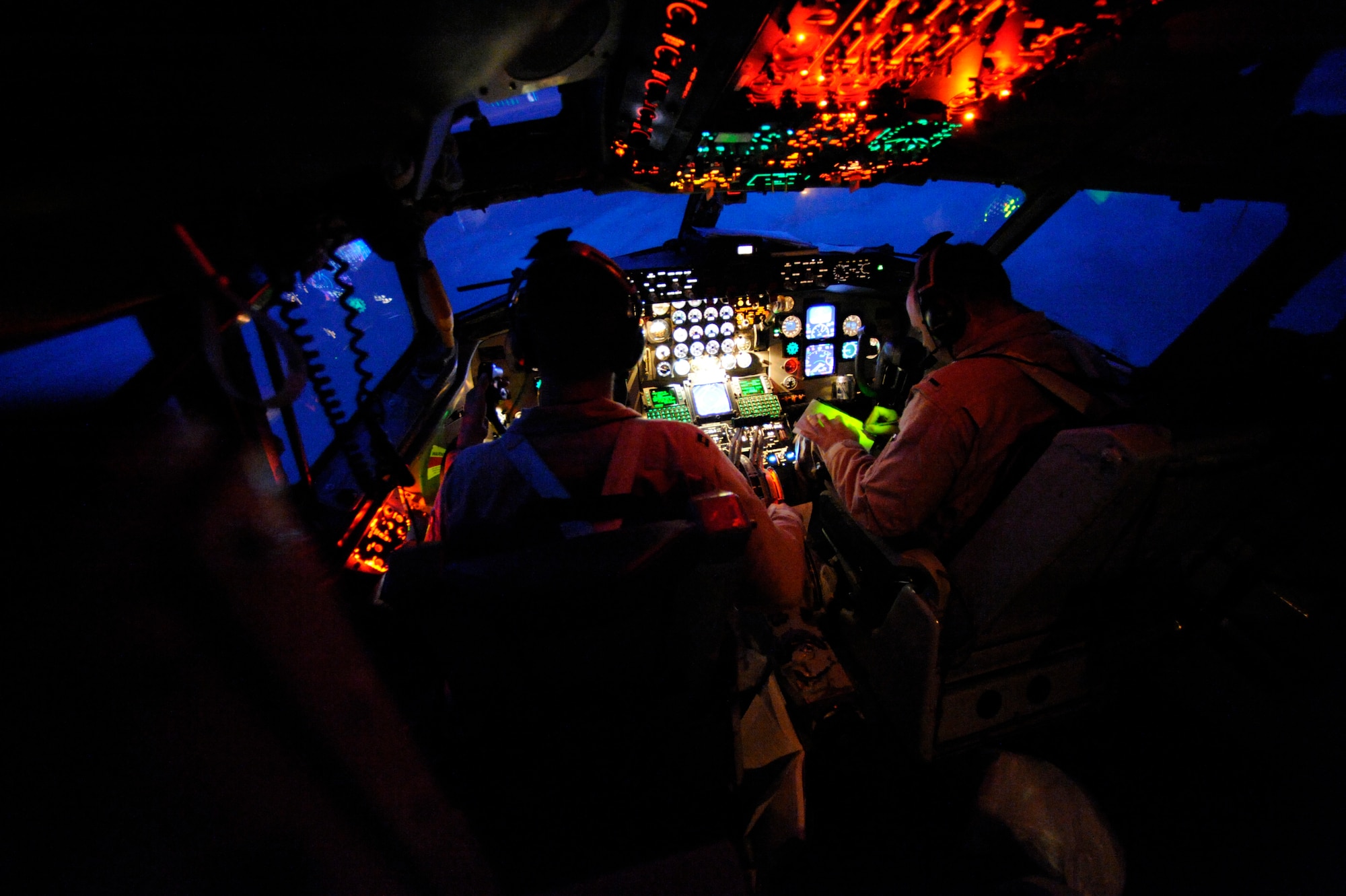 Capt. Micah Vander Veen (Left) and 1st Lt. Jake Houston, assigned to the 340th Expeditionary Air Refueling Squadron, fly a KC-135 air refueling mission Feb. 10, 2009, in support of Operation Iraqi Freedom.  Lt. Houston's home town is Buffalo, Ill., and Capt. Vandeer Veen is from Linden, Wash. (U.S. Air Force photo by Staff Sgt. James L. Harper Jr.) Released

