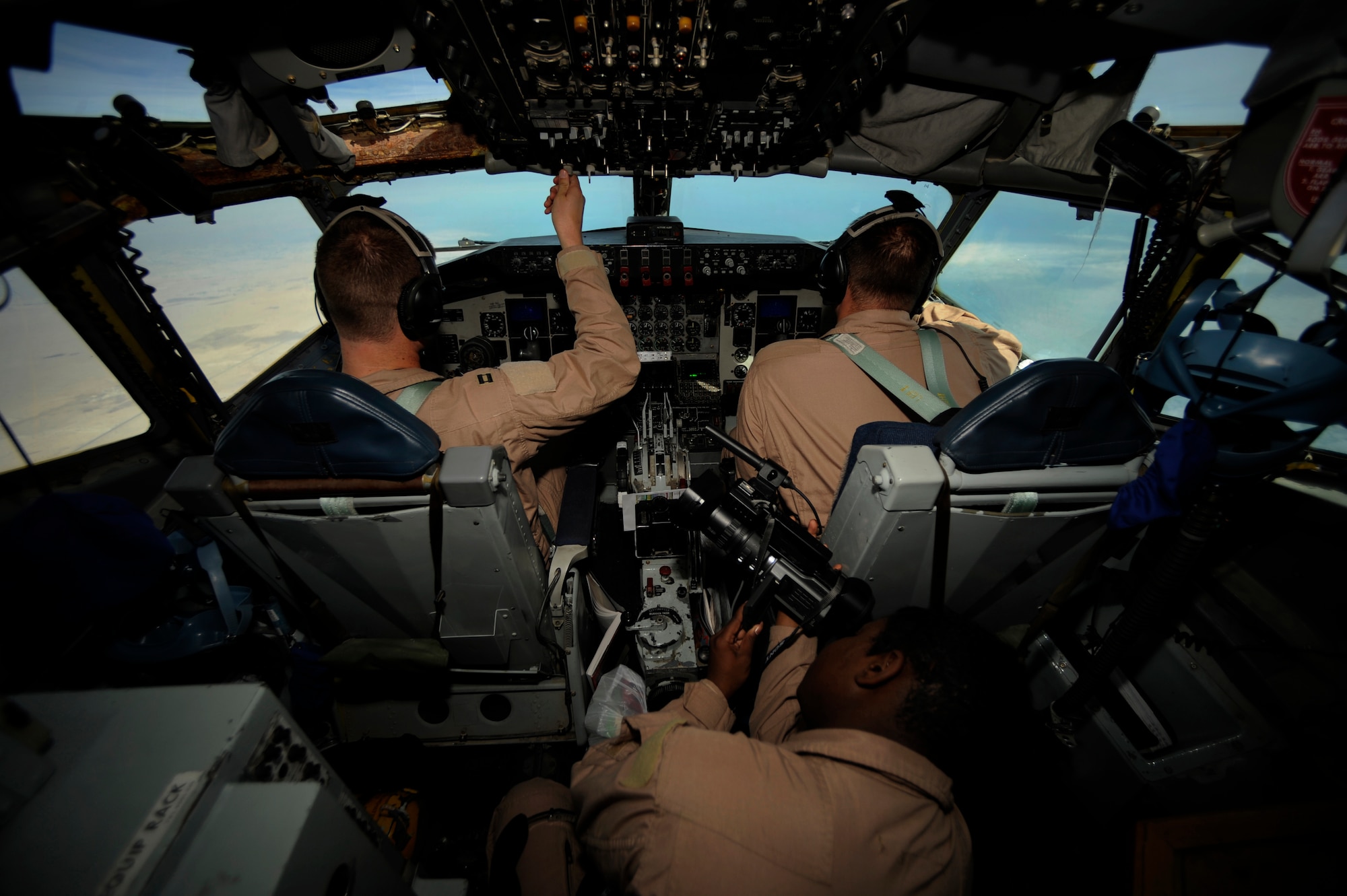 Capt. Micah Vander Veen (Left) and 1st Lt. Jake Houston (right), assigned to the 340th Expeditionary Air Refueling Squadron, fly a KC-135 Stratotanker air refueling mission while being documented by Sttaff Sgt. Chalanda Roberts, 1st Combat Camera Squadron, on Feb. 10, 2009. The mission was in support of Operation Iraqi Freedom.  Lt. Houston's home town is Buffalo, Ill., and Capt. Vandeer Veen is from Linden, Wash. (U.S. Air Force photo by Staff Sgt. James L. Harper Jr.) Released

