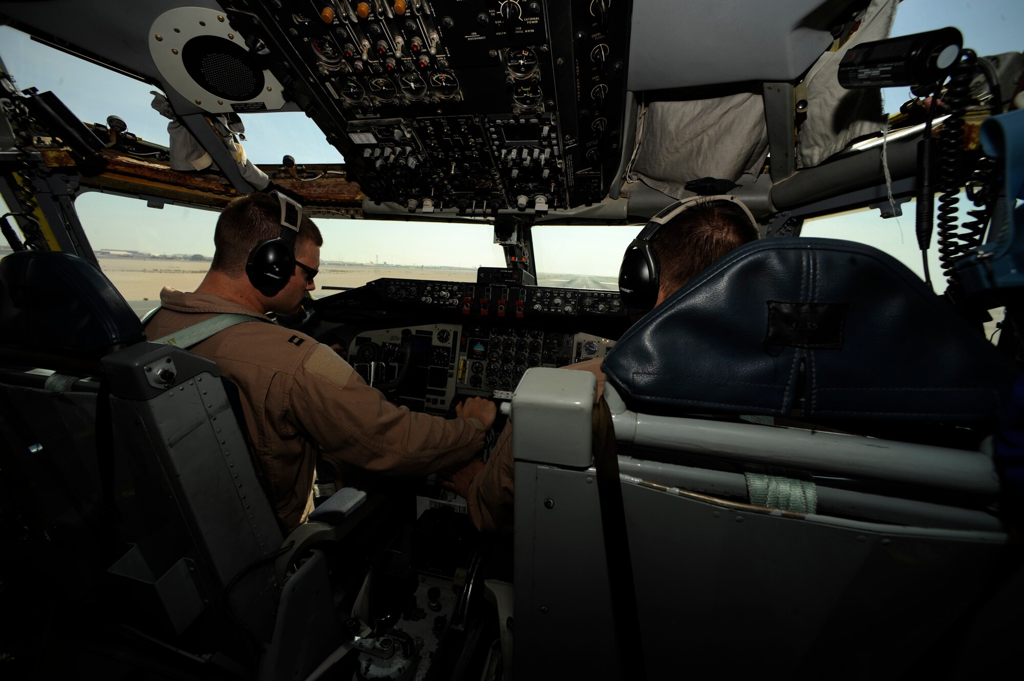 Capt. Micah Vander Veen (left) and 1st Lt. Jake Houston from the 340th Expeditionary Air Refueling Squadron prepare to take off aboard a KC-135 Stratotanker from a base in Southwest Asia on Feb. 10, 2009. The mission is in support of Operation Iraqi Freedom. Lt. Houston's home town is Buffalo, Ill., and Capt. Vandeer Veen is from Linden, Wash. (U.S. Air Force photo by Staff Sgt. James L. Harper Jr.) Released

