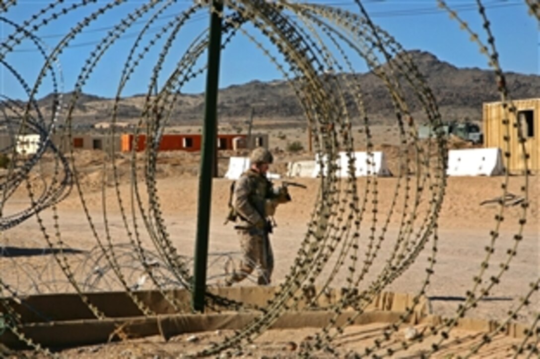 U.S. Marines patrol with role players during an exercise at Marine Corps Air Ground Combat Center, Twentynine Palms, Calif., Feb. 3, 2009. The Marines, assigned to 3rd Battalion, 3rd Marine Regiment, are training for their deployment to Afghanistan.
