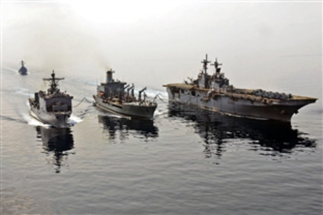 The forward-deployed amphibious assault ship USS Essex and amphibious dock landing ship USS Tortuga steam alongside the fleet replenishment oiler USNS Rappahannock, with the USS Stethem close behind, during a refueling-at-sea in the Gulf of Thailand, Feb. 6, 2009. The ships are preparing for Cobra Gold, an annual Kingdom of Thailand and U.S. co-sponsored military exercise to train U.S. and partner Asian-pacific forces.