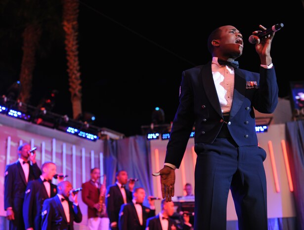 Staff Sgt. Corey Sims, a vocalist with Tops in Blue, performs before a large crowd at the Fremont Street Experience, Las Vegas, Nev., Feb. 11. Tops in Blue is an all-active duty U.S. Air Force special unit made up of talented amateur performers who perform for military personnel and their families throughout the world.(U.S. Air Force Photo/Senior Airman Larry E. Reid Jr.)